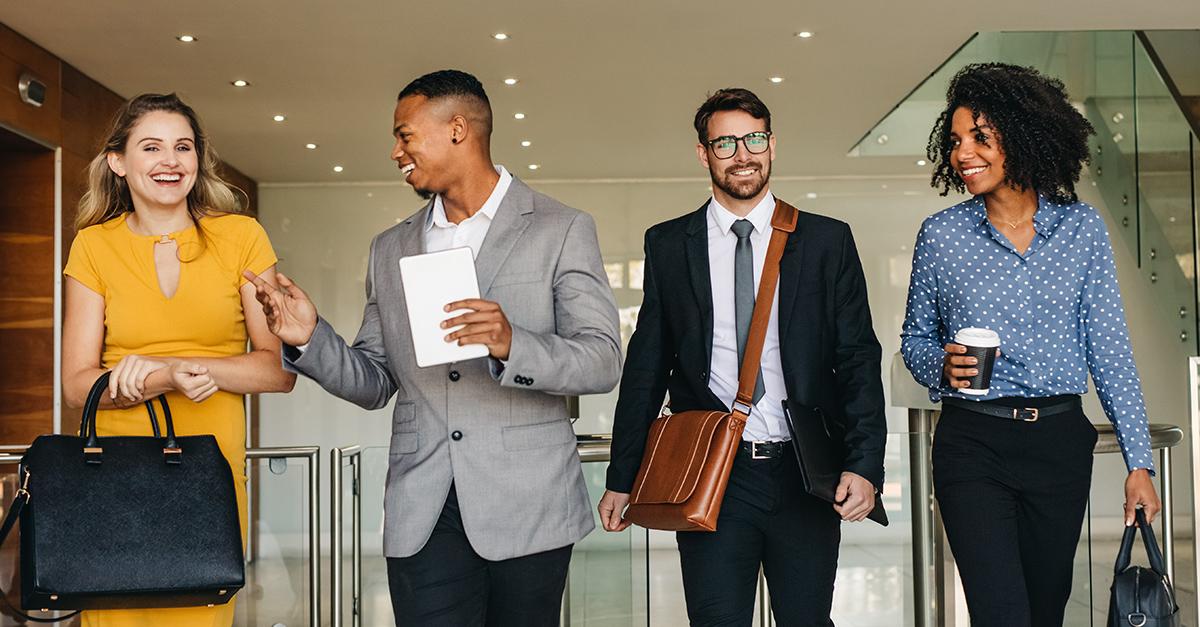 Diverse professionals shaking hands and collaborating
